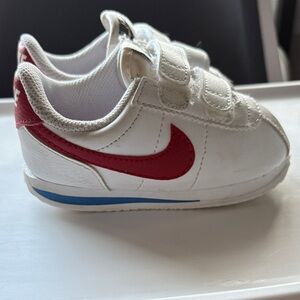 Nike Kids Sneakers with Red Swoosh and Blue Accent